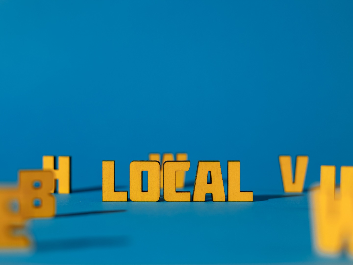 The word Local on a blue background
