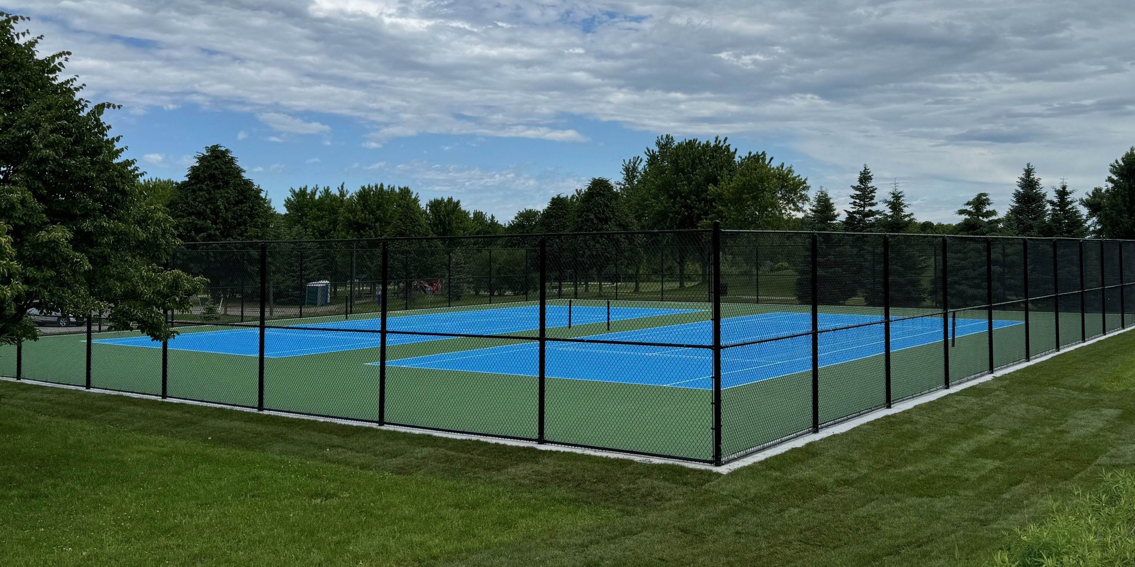 Fenced tennis courts 
