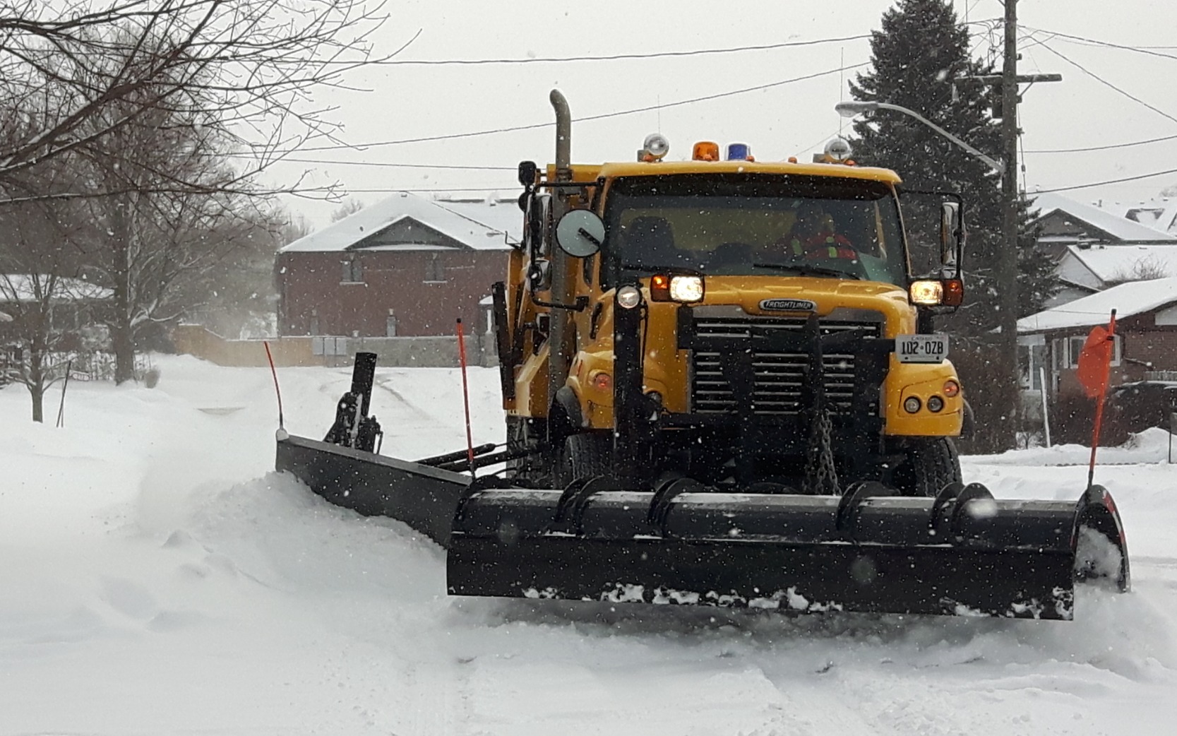EG snow plow clearing the road
