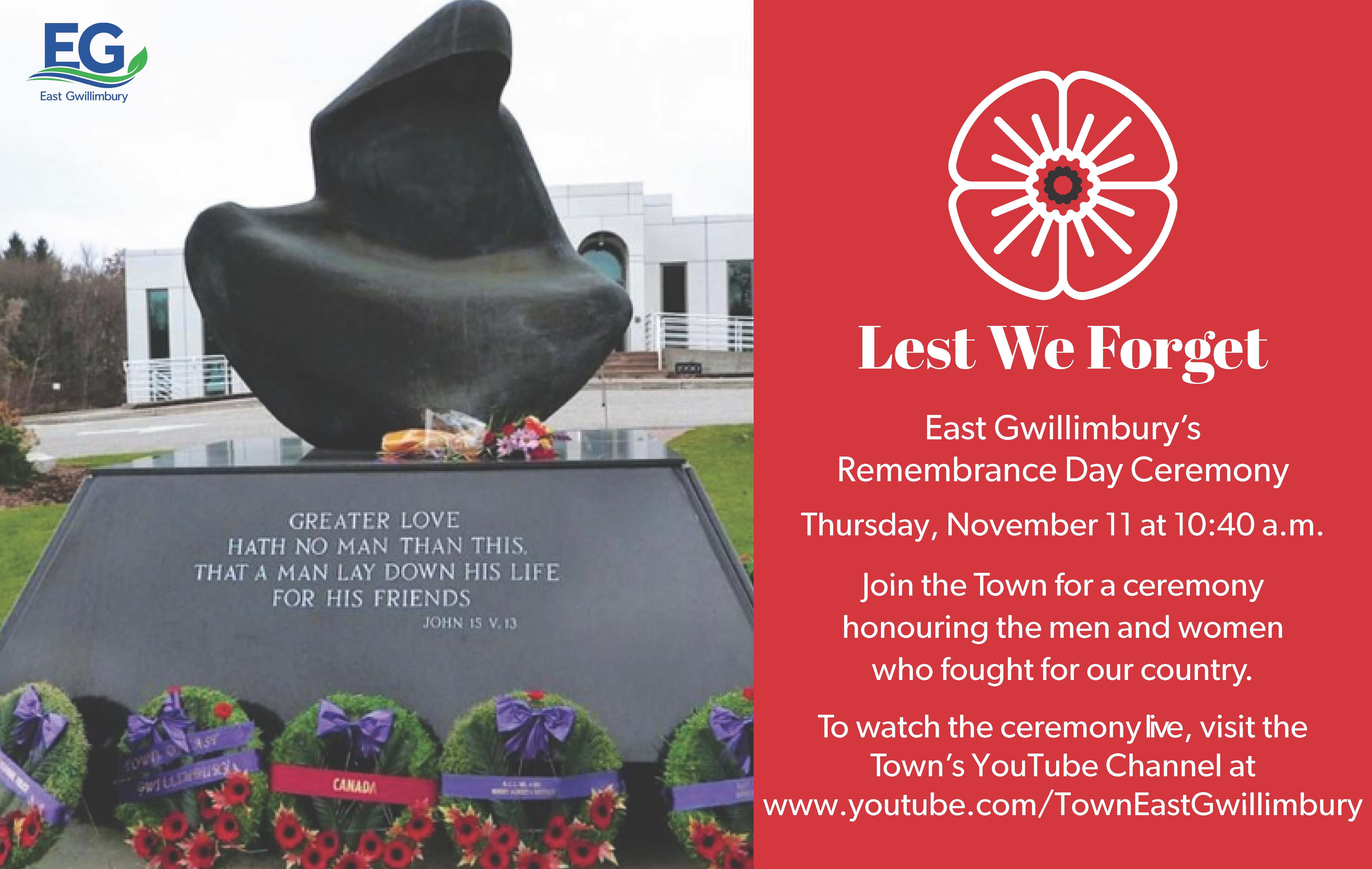 Civic centre statue with poppy wreaths at its base