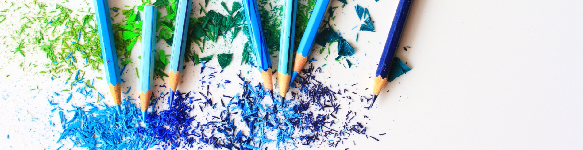 Blue and green pencil crayons and shavings