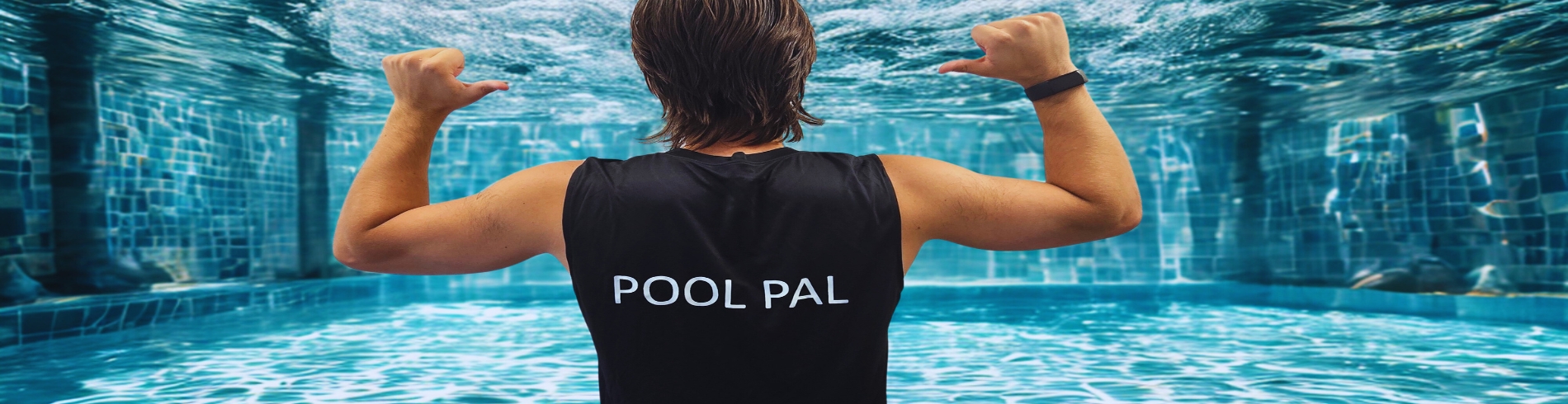A boy underwater with a shirt that says Pool Pal