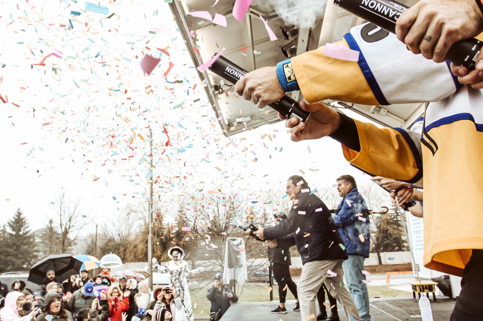 People shooting confetti