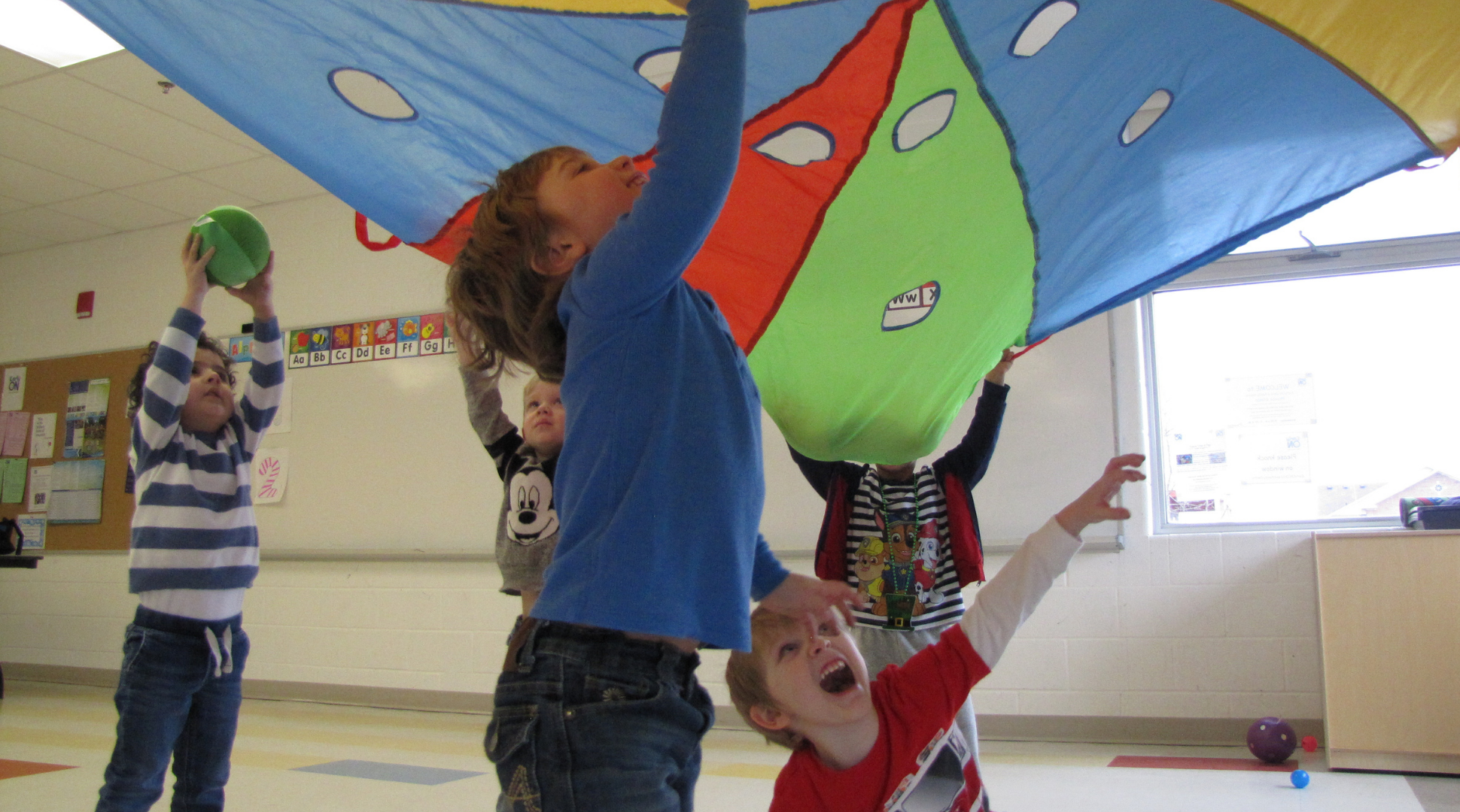 Children playing with parachute 