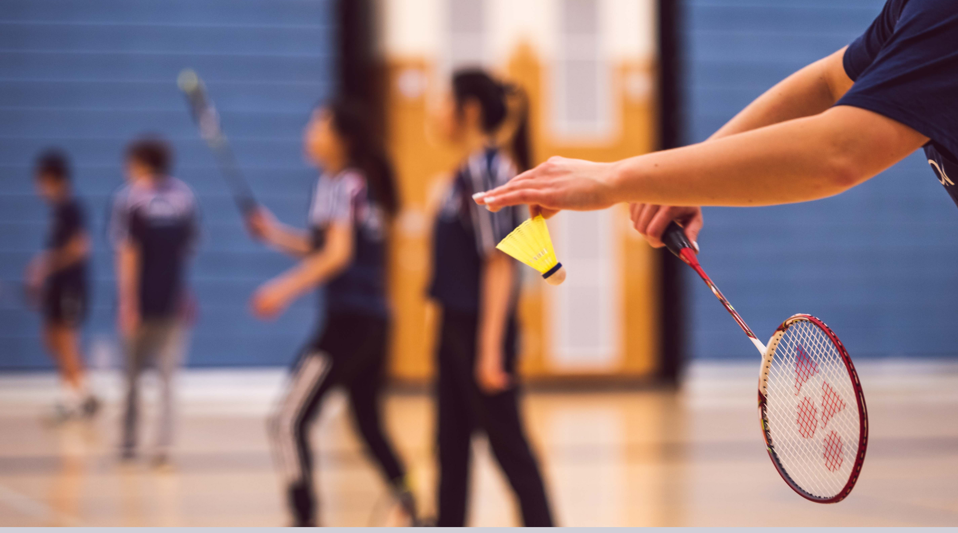 A people playing badminton 