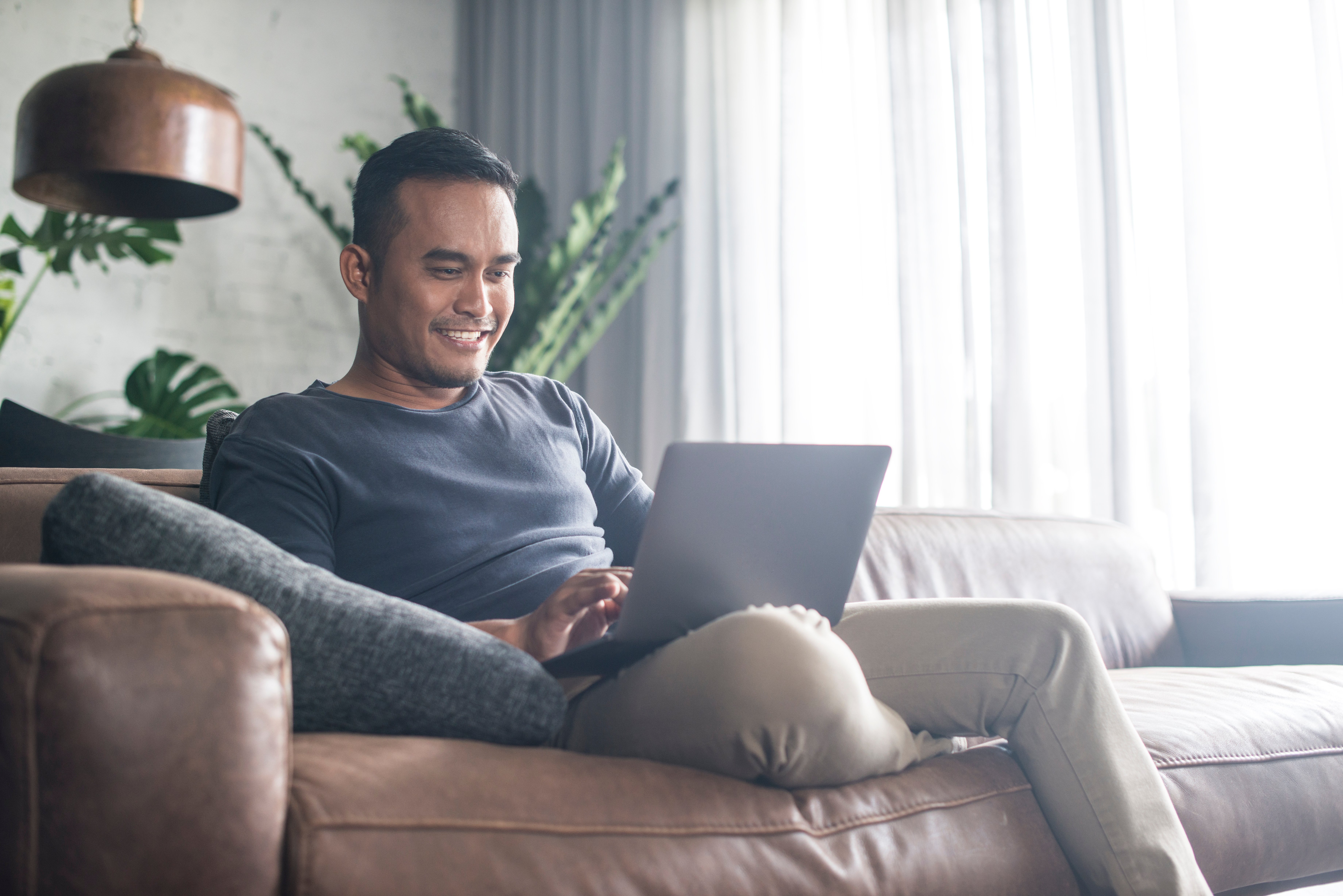 Man on laptop at home