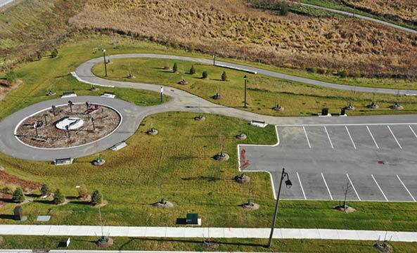 Overhead image of park with fitness equipment and empty parking spaces