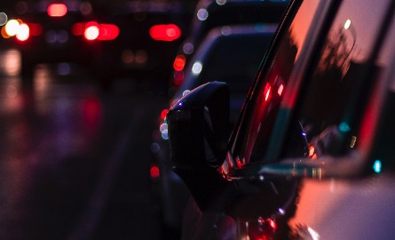 Cars parked on the road at night