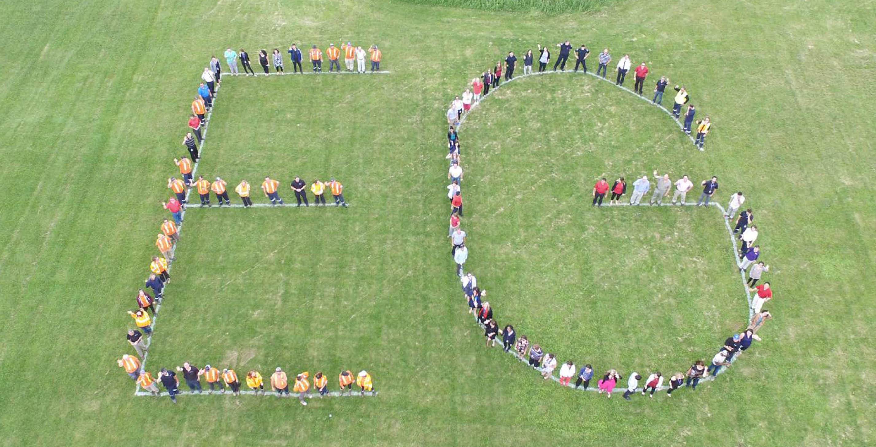 Town of East Gwillimbury staff spelling out EG in the grass