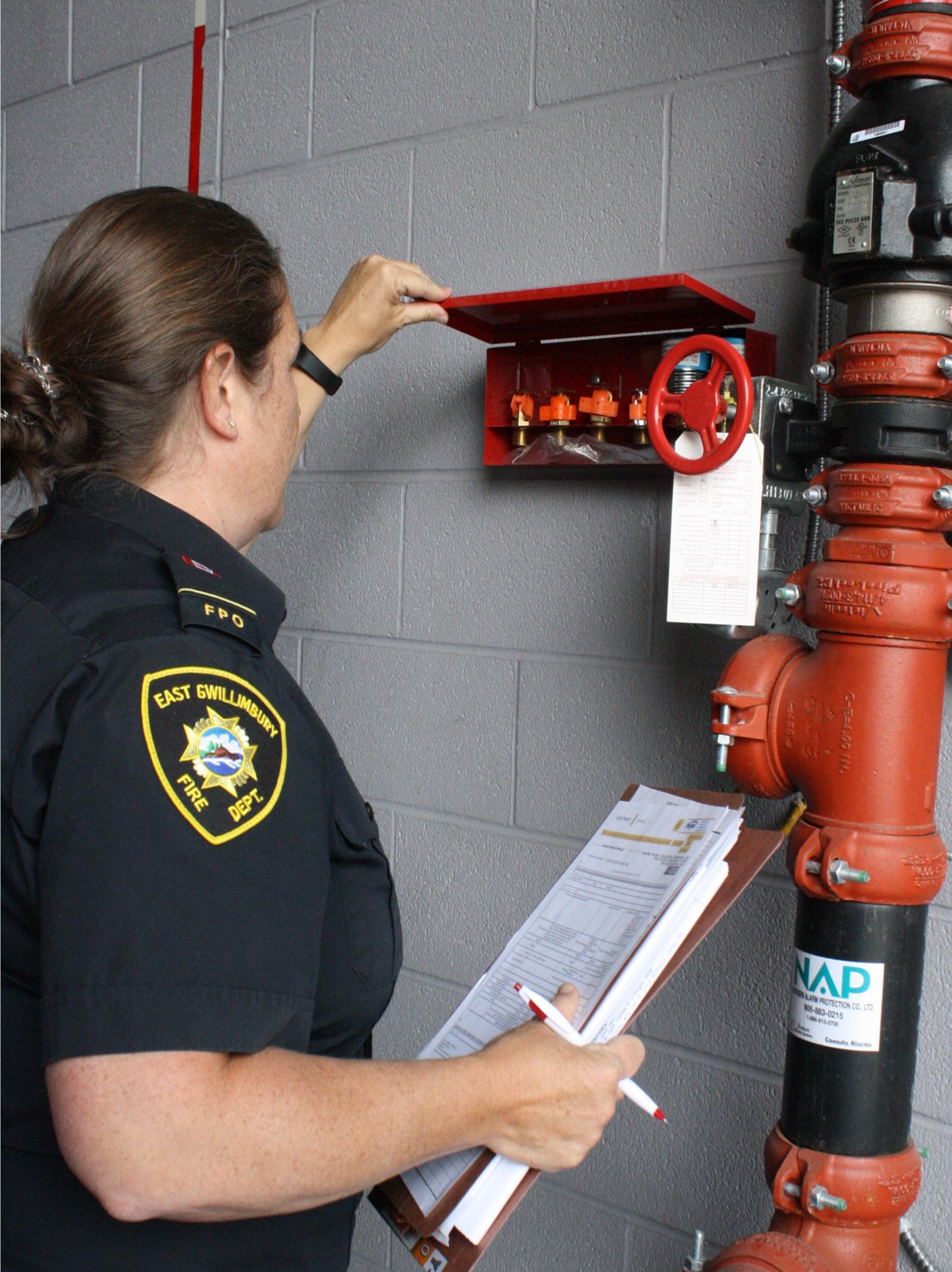 Fire prevention staff conduct a fire safety inspection.