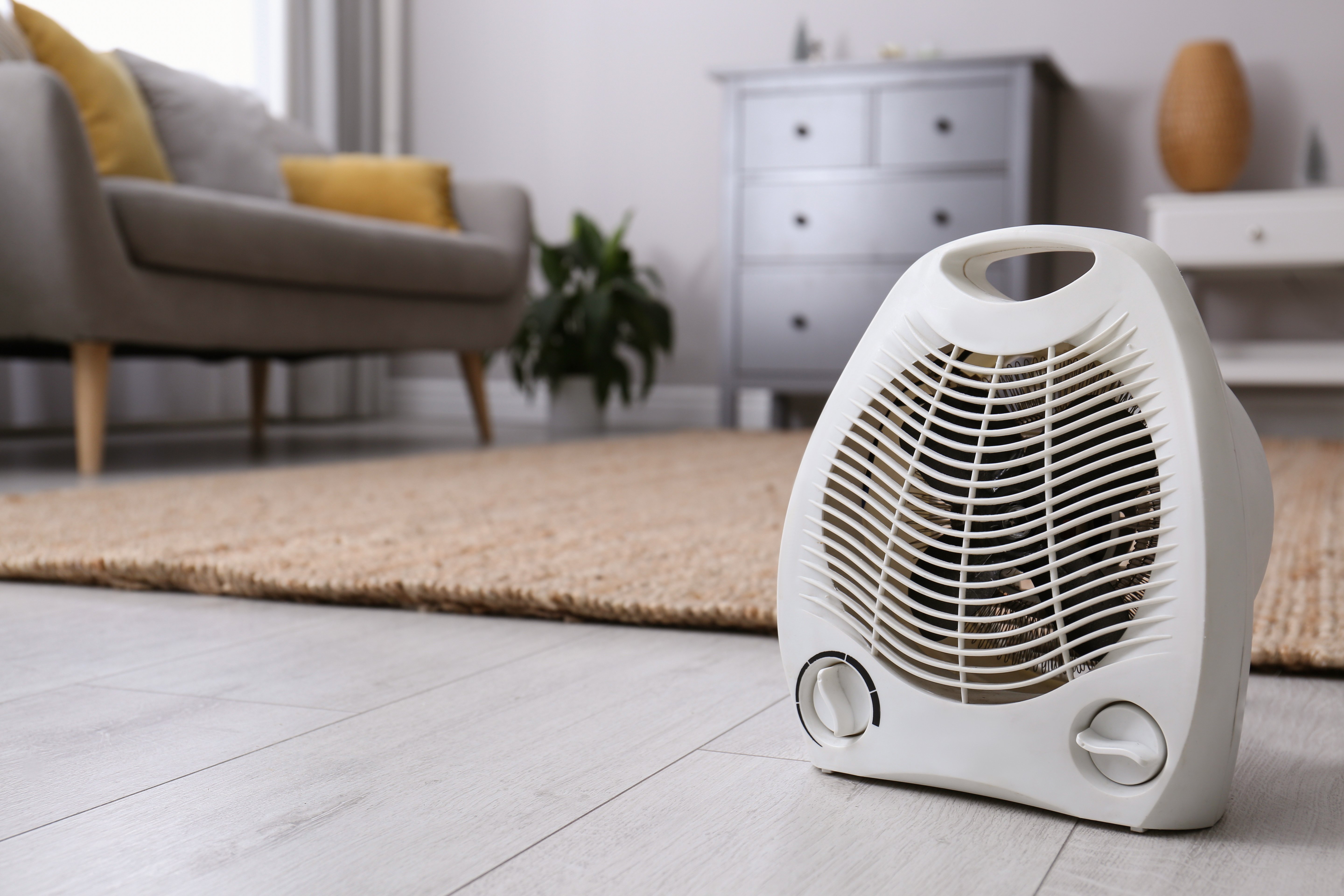 Portable heater on floor in open room