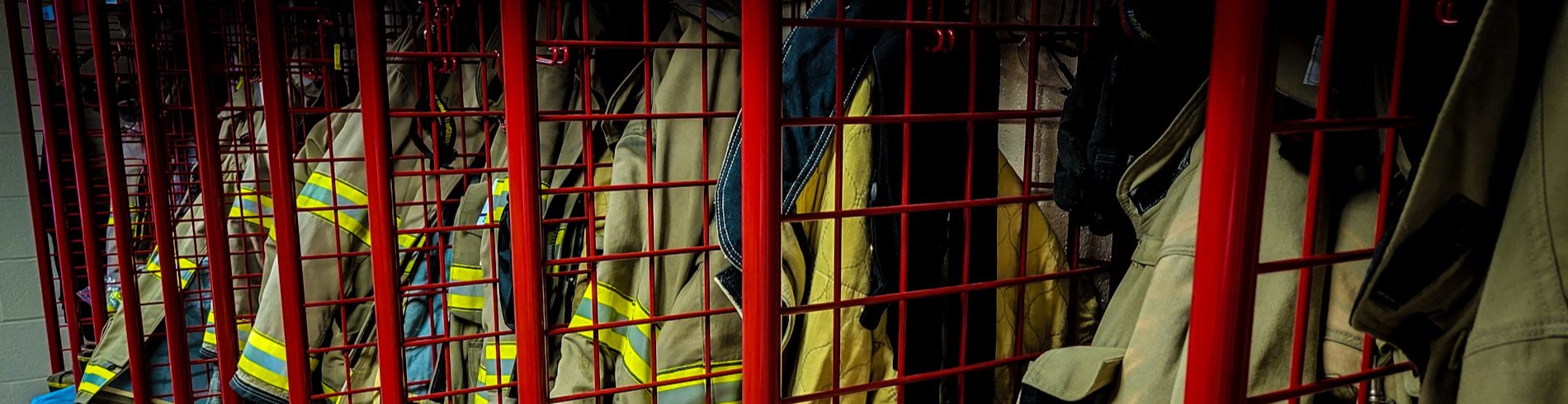 Firefighter gear hanging in lockers