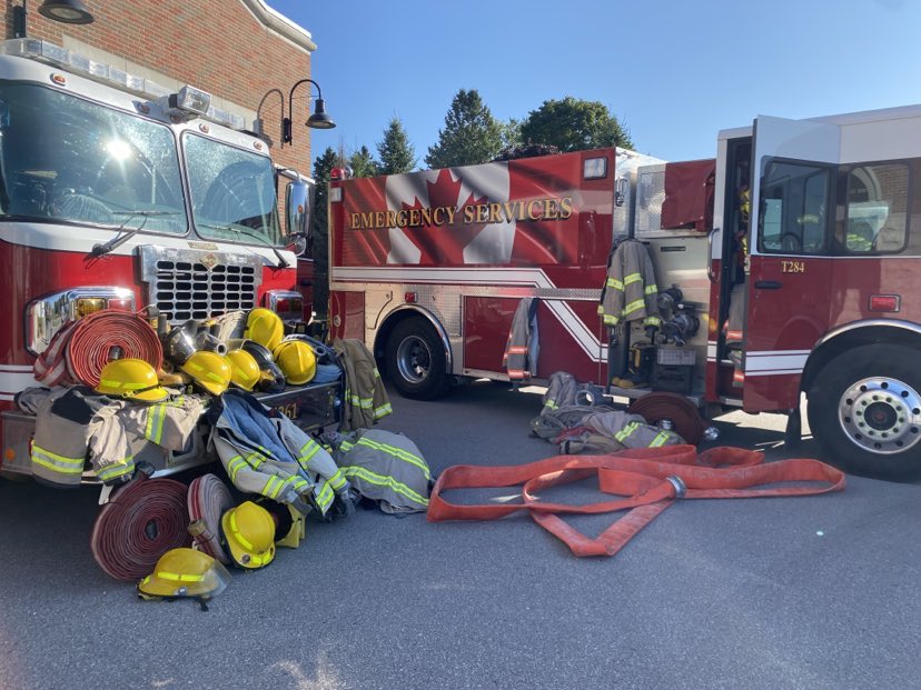 Fire trucks with donated gear in front