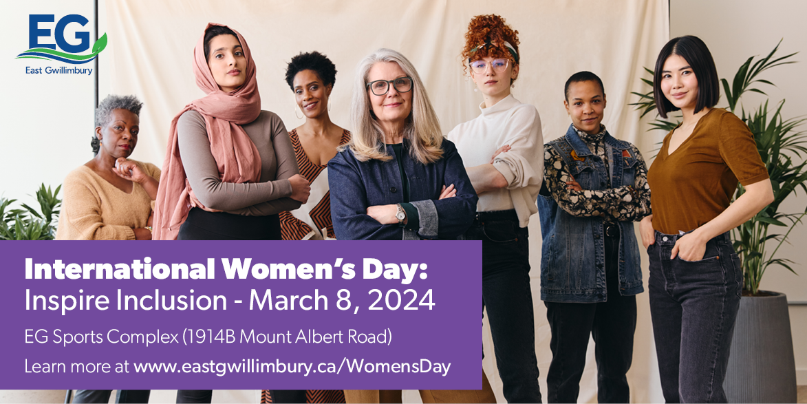 Women standing together with arms crossed and smiling faces