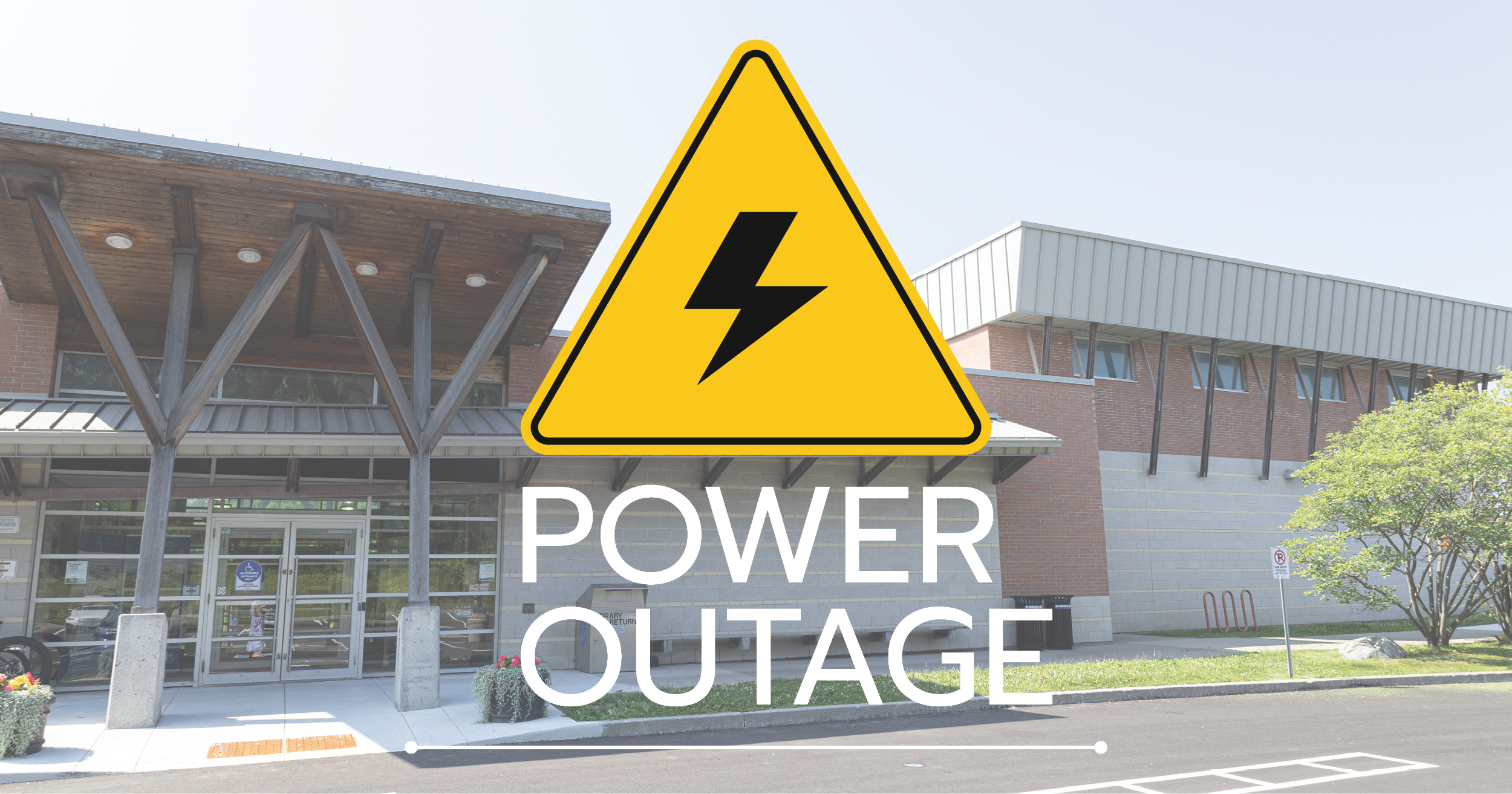 Exterior photo of the Ross Family Complex with a caution symbol and the words "power outage" written on top