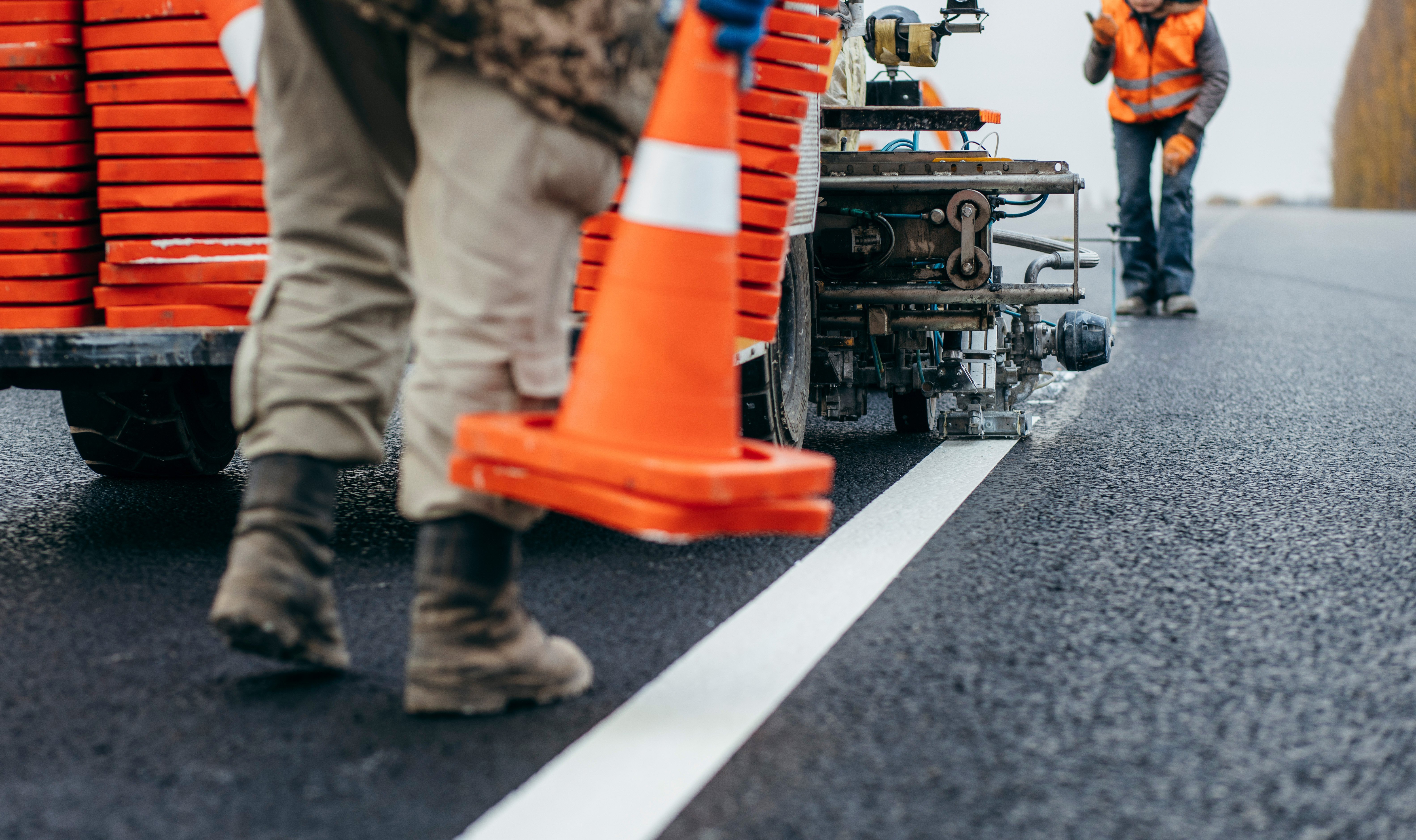 Photo of crew painting lines on the road